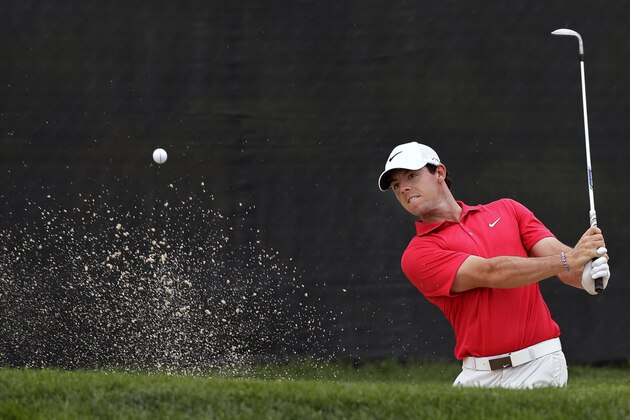 Rory McIlroy, of Northern Ireland, hits from a bunker on the 13th hole during the first round of play at The Barclays golf tournament Thursday, Aug. 21, 2014, in Paramus, N.J. (AP Photo/Mel Evans) Rory McIlroy, of Northern Ireland, hits from a bunker on the 13th hole during the first round of play at The Barclays golf tournament Thursday, Aug. 21, 2014, in Paramus, N.J. (AP Photo/Mel Evans)