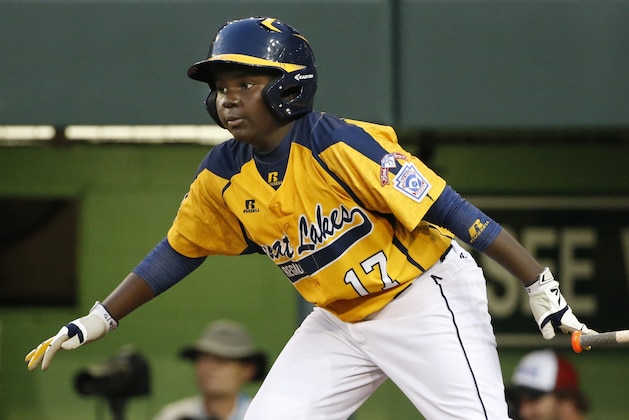 Chicago's Joshua Houston watches his ground out that drove in a run  off Pearland pitcher Walter Maeker III in the first inning inning of an elimination baseball game at the Little League World Series in South Williamsport, Pa., Tuesday, Aug. 19, 2014. (AP Photo/Gene J. Puskar