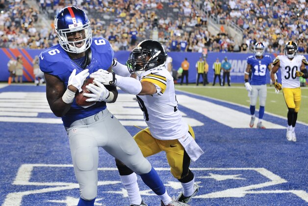 New York Giants wide receiver Corey Washington (6) makes a catch for a touchdown against Pittsburgh Steelers defensive back Isaiah Green (39) in the fourth quarter of a preseason NFL football game, Saturday, Aug. 9, 2014, in East Rutherford, N.J. (AP Photo/Bill Kostroun)