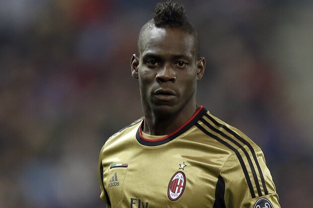 AC Milan's Mario Balotelli walks on the field during a Champions League, round of 16, second leg, soccer match between Atletico Madrid and AC Milan at the Vicente Calderon stadium in Madrid, Tuesday March 11, 2014. (AP Photo/Paul White)