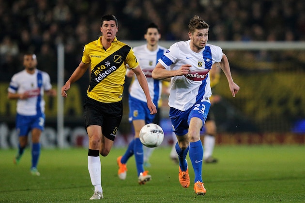 BREDA, NETHERLANDS - MARCH 08:  Stipe Perica of NAC and Jan-Arie Van Der Heijden of Vitesse battle for the ball during the Eredivisie match between NAC Breda and Vitesse at the Rat Verlegh Stadion on March 8, 2014 in Breda, Netherlands.  (Photo by Dean Mouhtaropoulos/Getty Images)