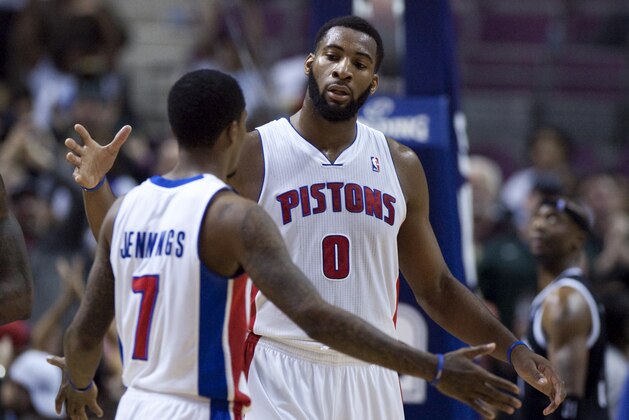 Detroit Pistons center Andre Drummond (0) celebrates with guard Brandon Jennings (7) after their 111-95 win over the Brooklyn Nets in an NBA basketball game on Friday, Feb. 7, 2014, in Auburn Hills, Mich. (AP Photo/Duane Burleson)