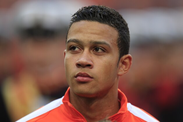 Netherlands' Memphis Depay lines up prior to the international friendly soccer match between Netherlands and Ecuador at ArenA stadium in Amsterdam, Netherlands, Saturday, May 17, 2014. (AP Photo/Peter Dejong)