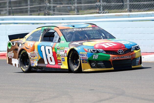 Aug 9, 2014; Watkins Glen, NY, USA; NASCAR Sprint Cup Series driver Kyle Busch (18) during practice for the Cheez-It 355 at Watkins Glen International. Mandatory Credit: Kevin Hoffman-USA TODAY Sports
