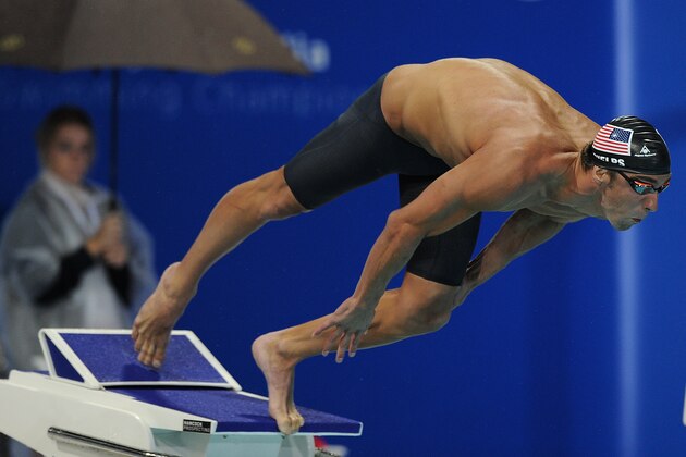 GOLD COAST, AUSTRALIA - AUGUST 22: Michael Phelps of the United States dives at the start of the the Men's 100m Freestyle Final during day two of the 2014 Pan Pacific Championships at Gold Coast Aquatics on August 22, 2014 on the Gold Coast, Australia.  (Photo by Matt Roberts/Getty Images)