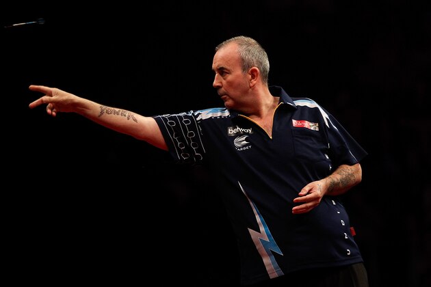 LONDON, ENGLAND - MAY 22:  Phil Taylor of England in action during the McCoys Premier League Darts Play-Offs Semi Final match between Raymond van Barneveld and Phil Taylor at O2 Arena on May 22, 2014 in London, England.  (Photo by Ben Hoskins/Getty Images)