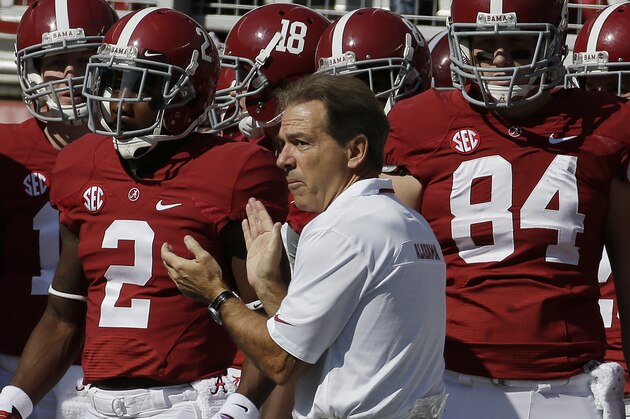Alabama head coach Nick Saban leads the Crimson Tide on the field prior to an NCAA college football game against Tennessee in Tuscaloosa, Ala., Saturday, Oct. 26, 2013. (AP Photo/Dave Martin)