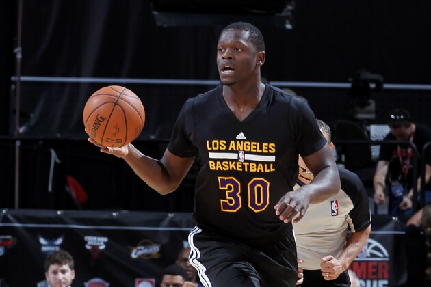 LAS VEGAS, NV - JULY 13: Julius Randle #30 of the Los Angeles Lakers drives against the New Orleans Pelicans at the Samsung NBA Summer League 2014 on July 13, 2014 at the Thomas & Mack Center in Las Vegas, Nevada. NOTE TO USER: User expressly acknowledges and agrees that, by downloading and or using this photograph, User is consenting to the terms and conditions of the Getty Images License Agreement. Mandatory Copyright Notice: Copyright 2014 NBAE (Photo by Jack Arent/NBAE via Getty Images)