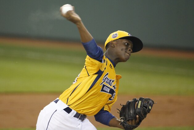 Chicago's Marquis Jackson delivers during the first inning of an elimination baseball game against Philadelphia at the Little League World Series tournament in South Williamsport, Pa., Thursday, Aug. 21, 2014. (AP Photo/Gene J. Puskar)