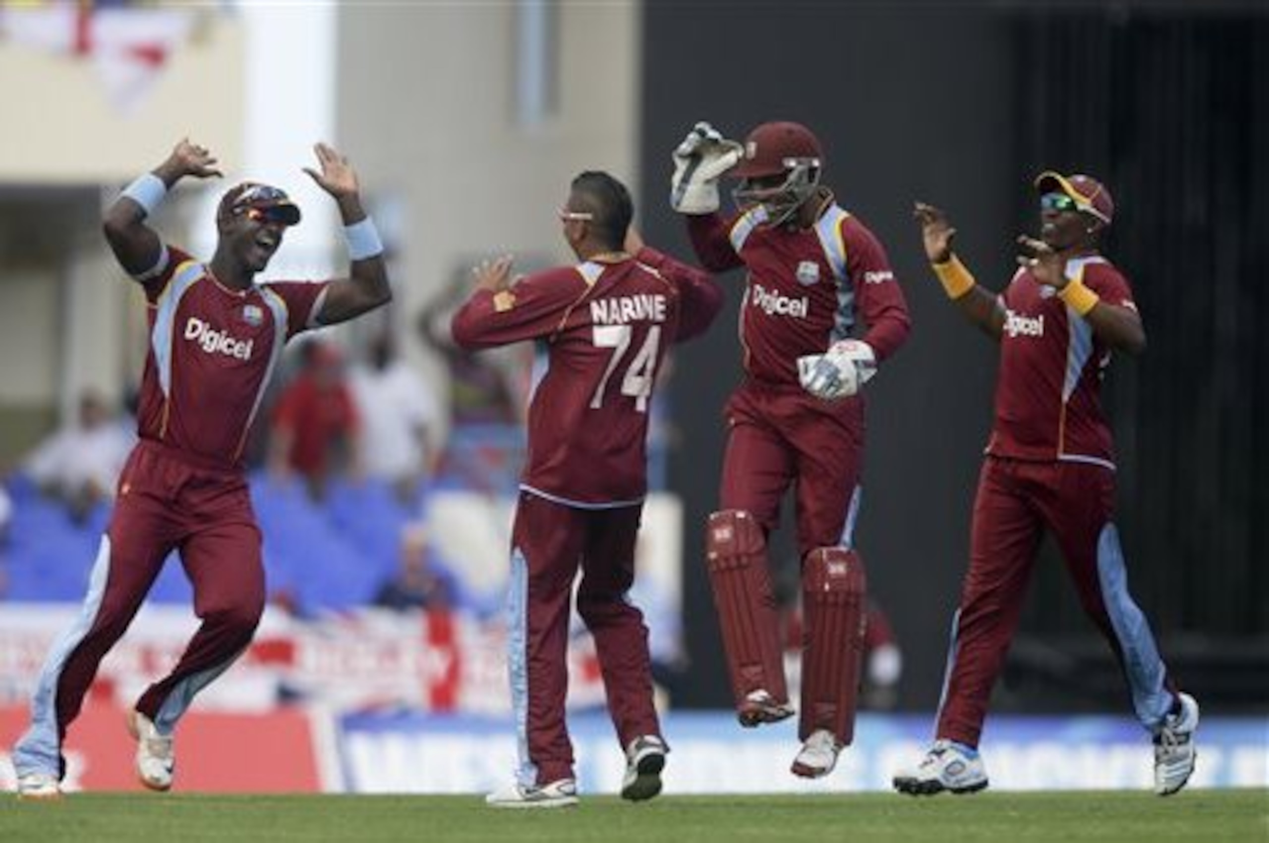 From left, West Indies' Darren Sammy, Sunil Narine, Denesh Ramdin and captain Dwayne Bravo celebrate taking the wicket of England's Luke Wright during their second one-day international cricket match at the Sir Vivian Richards Cricket Ground in St. John's, Antigua, Sunday, March 2, 2014. (AP Photo/Ricardo Mazalan) From left, West Indies' Darren Sammy, Sunil Narine, Denesh Ramdin and captain Dwayne Bravo celebrate taking the wicket of England's Luke Wright during their second one-day international cricket match at the Sir Vivian Richards Cricket Ground in St. John's, Antigua, Sunday, March 2, 2014. (AP Photo/Ricardo Mazalan)