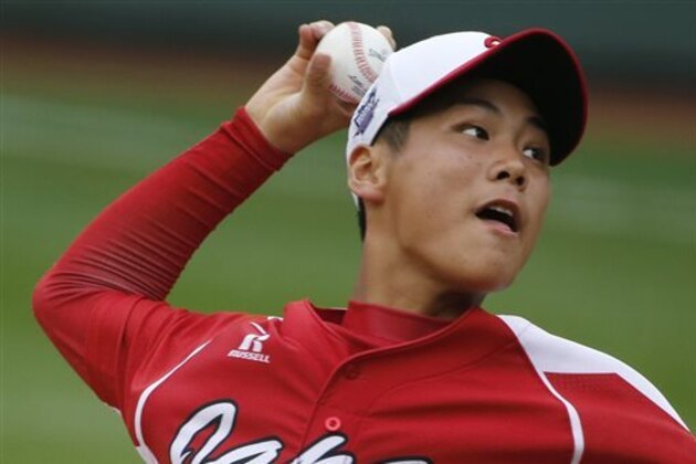 CORRECTS DATE AND YEAR TO AUG. 20, 2014 - Tokyo pitcher Takuma Takahashi delivers in the first inning of a International semi-final baseball game against Seoul at the Little League World Series tournament in South Williamsport, Pa., Wednesday, Aug. 20, 2014. (AP Photo/Gene J. Puskar)