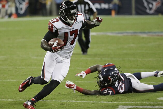 Atlanta Falcons' Devin Hester (17) evades Houston Texans' Josh Victorian (27) as he runs for a touchdown during the second quarter of an NFL preseason football game Saturday, Aug. 16, 2014, in Houston. (AP Photo/David J. Phillip)