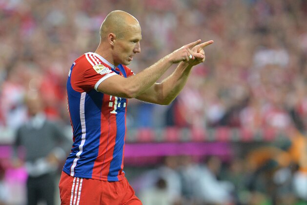 Bayern's Arjen Robben from the Netherlands celebrates after scoring during the soccer match between FC Bayern Munich and VfL Wolfsburg in the Allianz Arena in Munich, Germany, on Friday, Aug. 22, 2014. (AP Photo/Kerstin Joensson) Bayern's Arjen Robben from the Netherlands celebrates after scoring during the soccer match between FC Bayern Munich and VfL Wolfsburg in the Allianz Arena in Munich, Germany, on Friday, Aug. 22, 2014. (AP Photo/Kerstin Joensson)