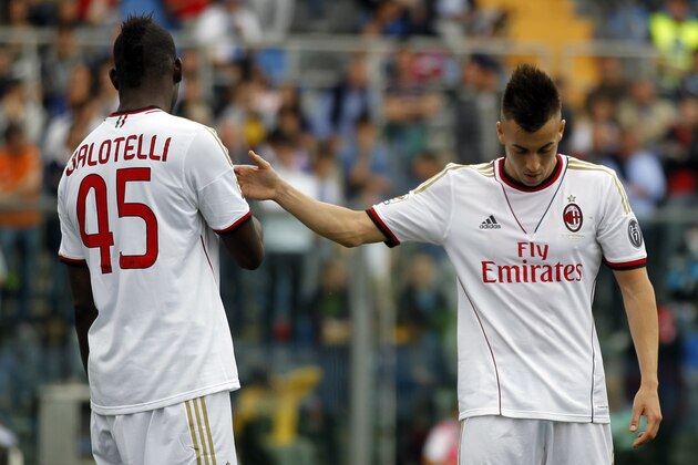 AC Milan's Stephan El Shaarawy, right, and teammate Mario Balotelli leave the field of play at the end of a Serie A soccer match against Atalanta in Bergamo, Italy, Sunday, May 11, 2014. Atalanta won 2-1. (AP Photo/Felice Calabro')