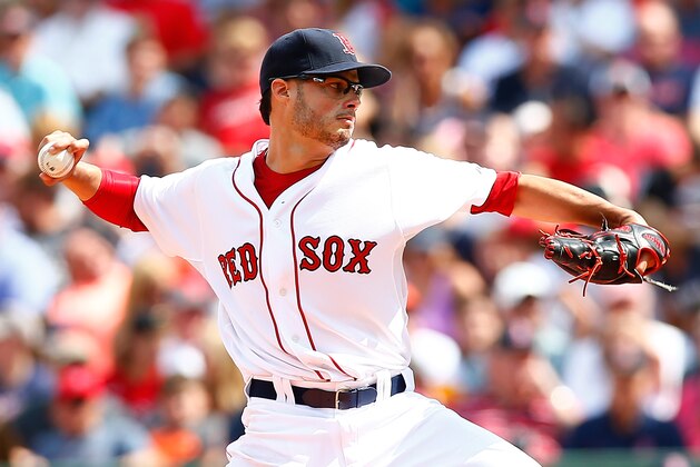 BOSTON, MA - AUGUST 17:  Joe Kelly #56 of the Boston Red Sox pitches against the Houston Astros during the game at Fenway Park on August 17, 2014 in Boston, Massachusetts.  (Photo by Jared Wickerham/Getty Images)
