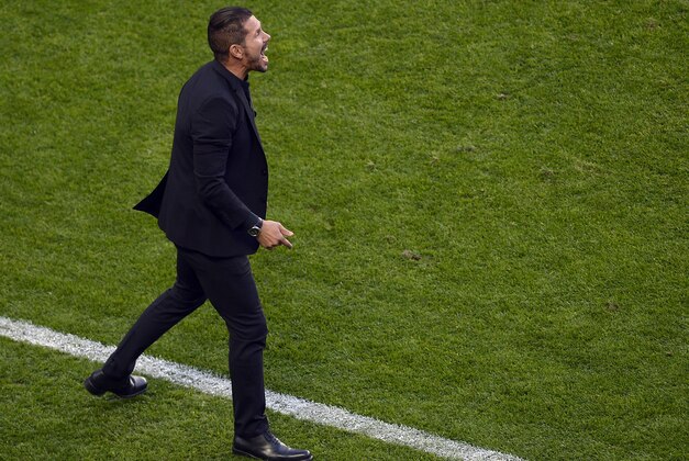 Atletico's coach Diego Simeone shouts during the Champions League final soccer match between Atletico Madrid and Real Madrid in Lisbon, Portugal, Saturday, May 24, 2014. (AP Photo/Paulo Duarte)
