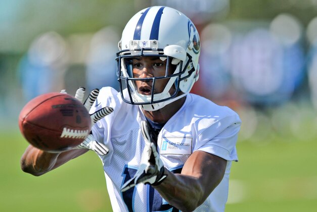 Jul 26, 2014; Nashville, TN, USA; Tennessee Titans wide receiver Justin Hunter (15) catches a pass during training camp at Saint Thomas Sports Park. Mandatory Credit: Jim Brown-USA TODAY Sports