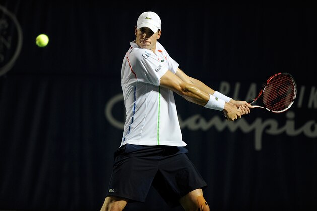 WINSTON SALEM, NC - AUGUST 20:  John Isner  returns a shot from Mikhail Kukushkin of Kazakhstan during the Winston-Salem Open at Wake Forest University on August 20, 2014 in Winston Salem, North Carolina.  (Photo by Jared C. Tilton/Getty Images)