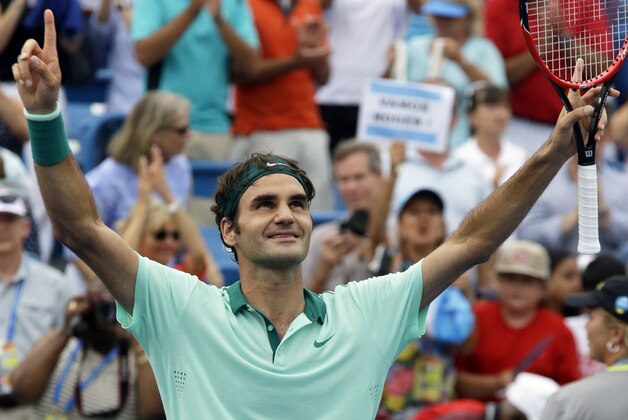 Roger Federer, from Switzerland, celebrates after defeating David Ferrer, from Spain, 6-3, 1-6, 6-2, in a final match at the Western and Southern Open tennis tournament, Sunday, Aug. 17, 2014, in Mason, Ohio. (AP Photo/Al Behrman)