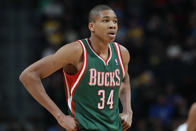 Milwaukee Bucks forward Giannis Antetokounmpo, of Greece, looks on against the Denver Nuggets in the third quarter of the Nuggets' 110-100 victory in an NBA basketball game in Denver on Wednesday, Feb. 5, 2014. (AP Photo/David Zalubowski)