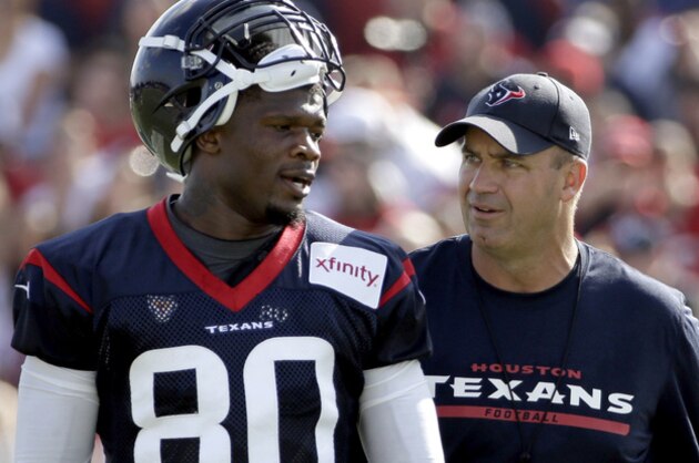 Houston Texans coach Bill O’Brien, right, talks to wide receiver Andre Johnson (80) during an NFL football training camp practice Sunday, July 27, 2014, in Houston. (AP Photo/David J. Phillip)