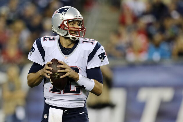 New England Patriots quarterback Tom Brady looks for a receiver against the Carolina Panthers defense in the first half of an NFL preseason football game Friday, Aug. 22, 2014, in Foxborough, Mass. (AP Photo/Charles Krupa) New England Patriots quarterback Tom Brady looks for a receiver against the Carolina Panthers defense in the first half of an NFL preseason football game Friday, Aug. 22, 2014, in Foxborough, Mass. (AP Photo/Charles Krupa)