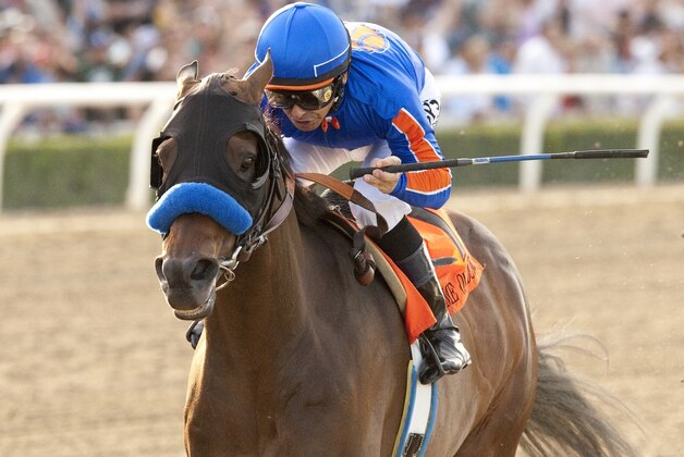 In a photo provided by Benoit Photo, Game On Dude and jockey Mike Smith win the $750,000 Santa Anita Handicap horse race Saturday, March 8, 2014, at Santa Anita in Arcadia, Calif. (AP Photo/Benoit Photo)