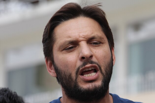 Pakistan's cricket all-rounder Shahid Afridi talks to reporters in Lahore, Pakistan, Friday, May 23, 2014. Afridi said he might quit playing one-day internationals after next year's World Cup in Australia and New Zealand and just concentrate on playing Twenty20s. (AP Photo/K.M. Chaudary)