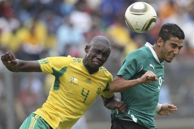 South Africa's Mulomowandou Mathoho, left, and Libya's  Mohamed Ghanudi, right, during their Under 23 Olympic qualifier in Daveyton, South Africa, Sunday March 27, 2011. (AP Photo)