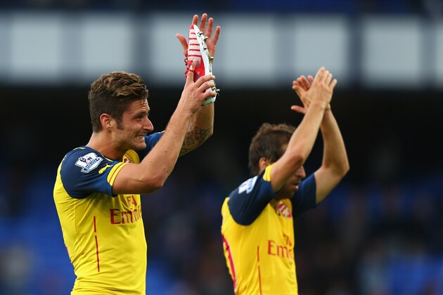 LIVERPOOL, ENGLAND - AUGUST 23:  Olivier Giroud of Arsenal salurs the fans at the end of the Barclays Premier League match between Everton and Arsenal at Goodison Park on August 23, 2014 in Liverpool, England.  (Photo by Clive Brunskill/Getty Images)