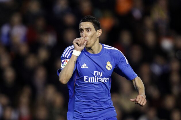 Real Madrid's  Angel Di Maria from Argentina celebrates after scoring against Valencia during their La Liga soccer match at the Mestalla stadium in Valencia, Spain, Sunday, Dec. 22, 2013. (AP Photo/Alberto Saiz)