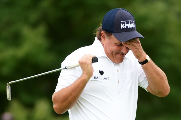 PARAMUS, NJ - AUGUST 23:  Phil Mickelson reacts after missing a putt for birdie on the 10th green during the third round of The Barclays at The Ridgewood Country Club on August 23, 2014 in Paramus, New Jersey.  (Photo by Ross Kinnaird/Getty Images)