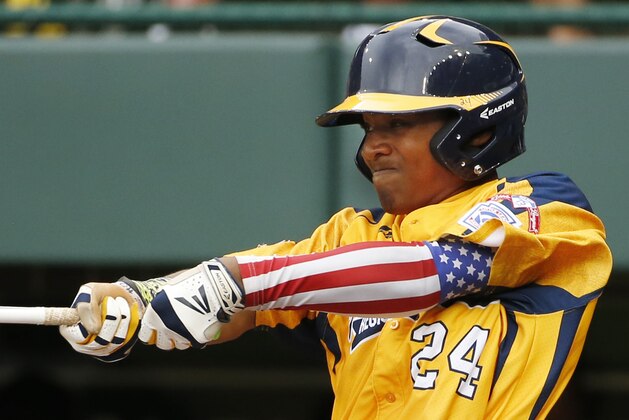 Chicago's Trey Hondras (24) hits a two-run home run off Las Vegas' Brennan Holligan in the first  inning of a United States Championship game at the Little League World Series tournament in South Williamsport, Pa., Saturday, Aug. 23, 2014. (AP Photo/Gene J. Puskar