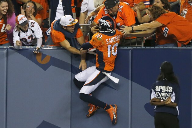 Denver Broncos wide receiver Emmanuel Sanders (10) celebrates his touchdown against the Houston Texans during the first half of an NFL preseason football game, Saturday, Aug. 23, 2014, in Denver. (AP Photo/Jack Dempsey)
