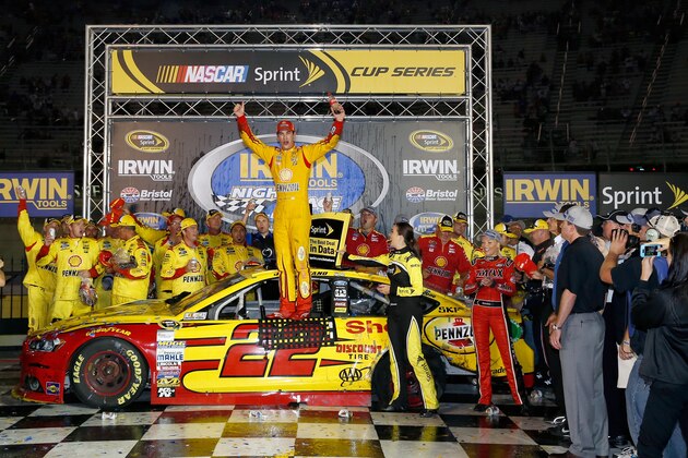 BRISTOL, TN - AUGUST 23:  Joey Logano, driver of the #22 Shell Pennzoil Ford, celebrates in Victory Lane after winning the NASCAR Sprint Cup Series Irwin Tools Night Race at Bristol Motor Speedway on August 23, 2014 in Bristol, Tennessee.  (Photo by Sean Gardner/Getty Images)
