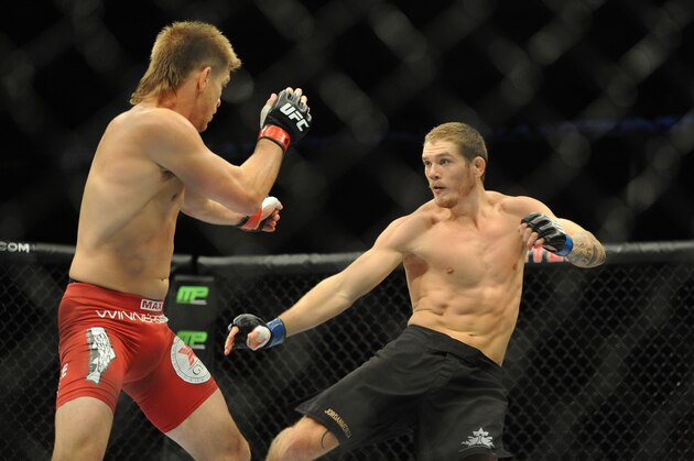 Aug 23, 2014; Tulsa, OK, USA; Mike Pyle (red gloves) fights Jordan Mein (blue gloves) in a Welterweight Bout at BOK Center. Mandatory Credit: Mark D. Smith-USA TODAY Sports Aug 23, 2014; Tulsa, OK, USA; Mike Pyle (red gloves) fights Jordan Mein (blue gloves) in a Welterweight Bout at BOK Center. Mandatory Credit: Mark D. Smith-USA TODAY Sports