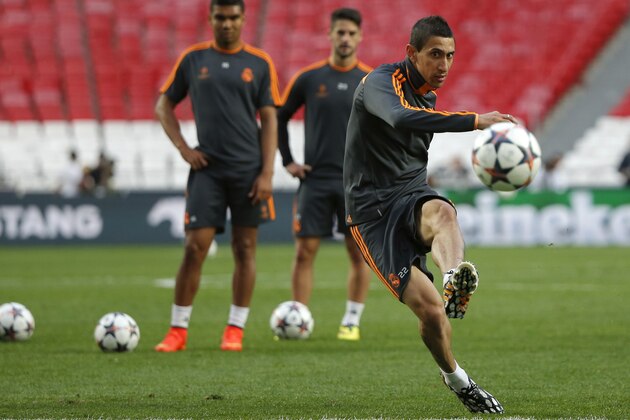 Real's Angel Di Maria kicks the ball,  during a training session ahead of Saturday's Champions League final soccer match between Real Madrid and Atletico Madrid, in Luz stadium in Lisbon, Portugal, Friday, May 23, 2014. (AP Photo/Andres Kudacki)
