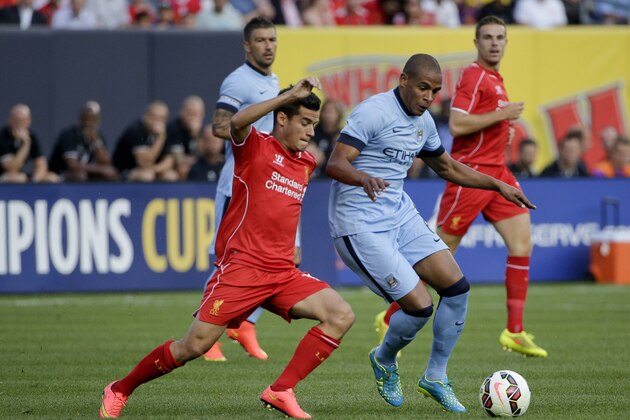 Liverpool midfielder Philippe Coutinho (10), left, challenges Manchester City midfielder Fernando (6) in the first half of a Guinness International Champions Cup soccer tournament match, Wednesday, July 30, 2014, at Yankee Stadium in New York. (AP Photo/Julie Jacobson)