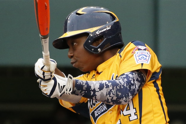 Chicago's Brandon Green (14) drives in a run with a single off Las Vegas' Zach Hare in the fifth inning of a United States Championship game at the Little League World Series tournament in South Williamsport, Pa., Saturday, Aug. 23, 2014. Chicago won 7-5. (AP Photo/Gene J. Puskar Chicago's Brandon Green (14) drives in a run with a single off Las Vegas' Zach Hare in the fifth inning of a United States Championship game at the Little League World Series tournament in South Williamsport, Pa., Saturday, Aug. 23, 2014. Chicago won 7-5. (AP Photo/Gene J. Puskar