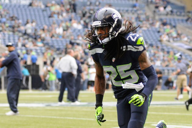 Aug 15, 2014; Seattle, WA, USA; Seattle Seahawks cornerback Richard Sherman (25) warms up before a game against the San Diego Chargers at CenturyLink Field. Mandatory Credit: James Snook-USA TODAY Sports
