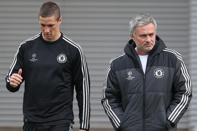 COBHAM, ENGLAND - OCTOBER 21: Chelsea manager Jose Mourinho chats with Fernando Torres during a Chelsea training session ahead of their UEFA Champions League Group E match against Schalke on October 21, 2013 in Cobham, England, (Photo by Charlie Crowhurst/Getty Images)