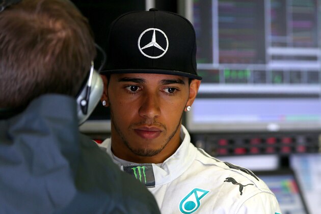 SPA, BELGIUM - AUGUST 23:  Lewis Hamilton of Great Britain and Mercedes GP looks on in the garage during qualifying ahead of the Belgian Grand Prix at Circuit de Spa-Francorchamps on August 23, 2014 in Spa, Belgium.  (Photo by Mark Thompson/Getty Images)