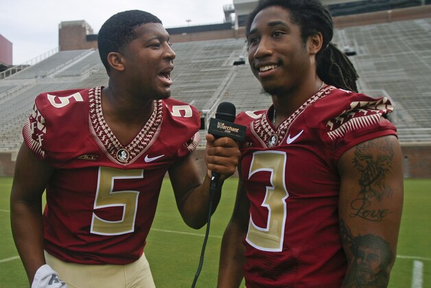 Florida State quarterback Jameis Winston (5) interviews defensive back Ronald Darby (3) during their NCAA college football media day on Sunday, Aug. 10, 2014, in Tallahassee, Fla. (AP Photo/Phil Sears)