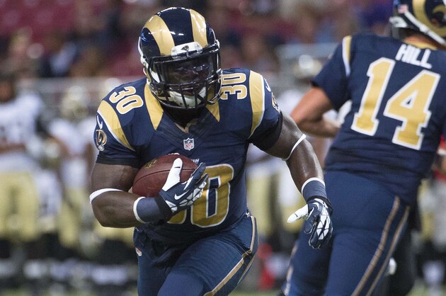 Aug 8, 2014; St. Louis, MO, USA; St. Louis Rams running back Zac Stacy (30) rushes against the New Orleans Saints at Edward Jones Dome. Mandatory Credit: Scott Rovak-USA TODAY Sports
