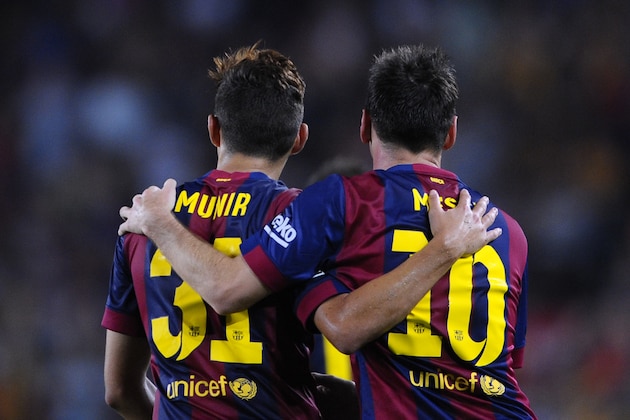 FC Barcelona's Lionel Messi from Argentina, right, reacts after scoring with his teammate Munir against Elche during a Spanish La Liga soccer match at the Camp Nou stadium in Barcelona, Spain, Sunday, Aug. 24, 2014. (AP Photo/Manu Fernandez)