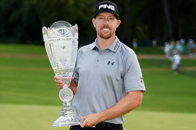 PARAMUS, NJ - AUGUST 24:  Hunter Mahan celebrates with the tournament trophy after winning of The Barclays at The Ridgewood Country Club on August 24, 2014 in Paramus, New Jersey.  (Photo by Ross Kinnaird/Getty Images)