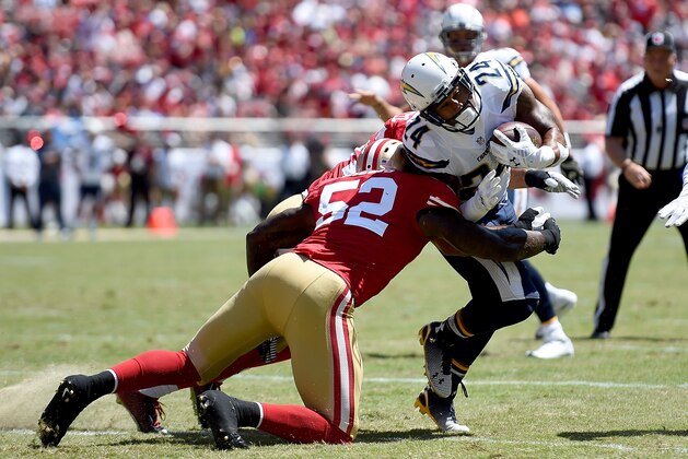 SANTA CLARA, CA - AUGUST 24: Running back Ryan Mathews #24 of the San Diego Chargers gets hit by line backer Patrick Willis #52 of the San Francisco 49ers during the second quarter of their preseason game at Levi's Stadium on August 24, 2014 in Santa Clara, California. (Photo by Thearon W. Henderson/Getty Images)