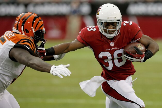 Arizona Cardinals running back Andre Ellington (38) stiff arms Cincinnati Bengals defensive end Wallace Gilberry during the first half of an NFL preseason football game, Sunday, Aug. 24, 2014, in Glendale, Ariz. (AP Photo/Ross D. Franklin)
