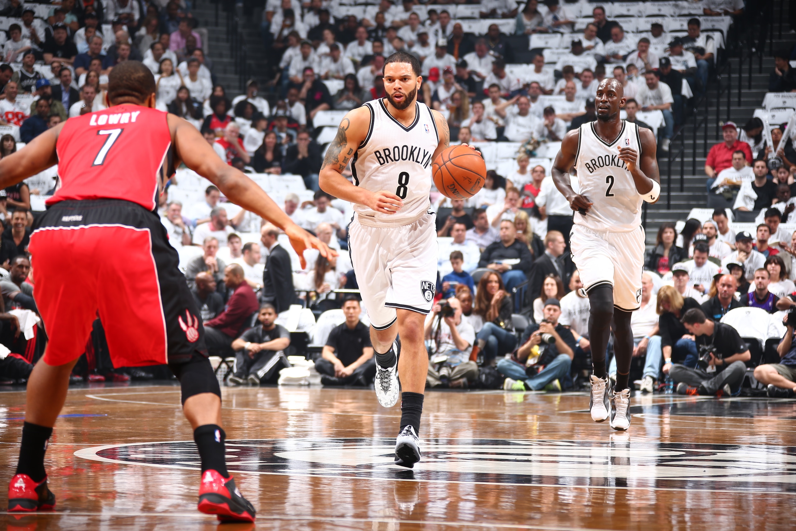 BROOKLYN, NY - MAY 2: Deron Williams #8 of the Brooklyn Nets dribbles up the court against the Toronto Raptors during Game Six of the Eastern Conference Quarterfinals at Barclays Center on May 2, 2014 in the Brooklyn borough of New York City.  NOTE TO USER: User expressly acknowledges and agrees that, by downloading and/or using this Photograph, user is consenting to the terms and conditions of the Getty Images License Agreement. Mandatory Copyright Notice: Copyright 2014 NBAE (Photo by Nathaniel S. Butler/NBAE via Getty Images)