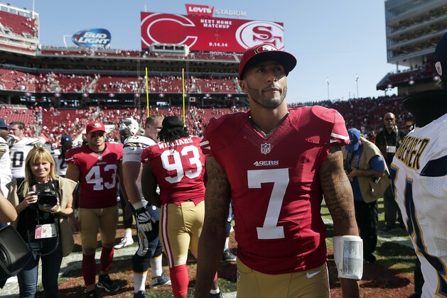 San Francisco 49ers quarterback Colin Kaepernick (7) walks off the field after an NFL preseason football game against the San Diego Chargers in Santa Clara, Calif., Sunday, Aug. 24, 2014. The 49ers won 21-7. (AP Photo/Marcio Jose Sanchez)